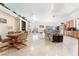 Open-concept kitchen and living area with tile flooring and bright, natural light at 4116 Villa Flora St, Las Vegas, NV 89130
