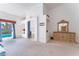 Open primary bedroom with neutral carpet and direct patio access to a pool beyond sliding glass doors at 4116 Villa Flora St, Las Vegas, NV 89130