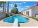 Inviting pool with diving board and lush landscaping, ideal for relaxing and entertaining at 4116 Villa Flora St, Las Vegas, NV 89130