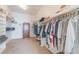Spacious walk-in closet featuring built-in shelving and hanging racks for optimal storage and organization at 4116 Villa Flora St, Las Vegas, NV 89130