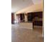 Spacious kitchen features dark wood cabinets, tile backsplash, and island at 5005 Wild Thyme Ave, Las Vegas, NV 89131