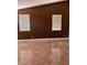 Living room features a vaulted ceiling, tan tile floor, and natural light at 5005 Wild Thyme Ave, Las Vegas, NV 89131