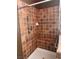 Tiled shower with grab bars and a built-in seat ensures a secure and comfortable bathing experience at 5005 Wild Thyme Ave, Las Vegas, NV 89131
