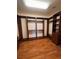 Spacious walk-in closet with custom built-ins, hardwood flooring, and ample storage solutions at 5005 Wild Thyme Ave, Las Vegas, NV 89131