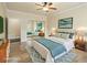 Comfortable bedroom with tile floors, ample lighting, and a double mirrored closet at 5340 N Campbell Rd, Las Vegas, NV 89149