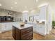Modern kitchen with white cabinets, center island, stainless steel appliances and breakfast bar at 5340 N Campbell Rd, Las Vegas, NV 89149