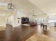 Spacious living area with a fireplace, ceiling fan and an open-concept kitchen at 5340 N Campbell Rd, Las Vegas, NV 89149