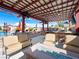 Inviting outdoor living space with covered patio, comfortable seating, and an outdoor kitchen at 5340 N Campbell Rd, Las Vegas, NV 89149