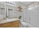 Bright bathroom with a vanity sink and shower and frosted glass door at 5512 Goldbrush St, Las Vegas, NV 89130