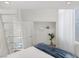 Bright bedroom with a loft, a walk-in closet and a large window with white curtains at 5512 Goldbrush St, Las Vegas, NV 89130