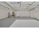 Spacious garage with ceiling storage and organized equipment along the walls at 5512 Goldbrush St, Las Vegas, NV 89130