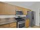 Functional kitchen space features stainless steel appliances and granite counter tops at 5512 Goldbrush St, Las Vegas, NV 89130