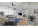 Open-concept living area with stylish furniture, a ceiling fan, and seamless flow to other rooms at 5512 Goldbrush St, Las Vegas, NV 89130
