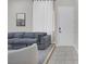 Comfortable living room with a gray sofa and natural light from the large window at 5512 Goldbrush St, Las Vegas, NV 89130