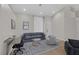 Modern living space featuring a sofa, a desk, light-colored walls, and sleek furnishings at 5512 Goldbrush St, Las Vegas, NV 89130