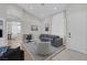 Open-concept living area featuring sleek furnishings, an area rug, and ample natural light at 5512 Goldbrush St, Las Vegas, NV 89130