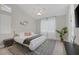A bright main bedroom features a ceiling fan and patterned rug at 5512 Goldbrush St, Las Vegas, NV 89130