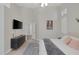 A bright main bedroom features a TV, patterned rug, and neutral walls at 5512 Goldbrush St, Las Vegas, NV 89130