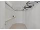 A walk-in closet featuring shelves, an ironing board and rod for hanging clothes at 5512 Goldbrush St, Las Vegas, NV 89130