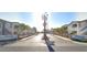 A gated entrance to the Terrasanta Condominiums community with lush landscaping and well-maintained buildings at 5655 E Sahara Ave # 1053, Las Vegas, NV 89142