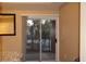Bedroom with a sliding glass door leading to a patio, offering natural light and outdoor access at 63 E Agate Ave # 202, Las Vegas, NV 89123