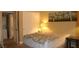 Comfortable bedroom with soft lighting, neutral colors, a double door closet, and a painting on the wall at 63 E Agate Ave # 202, Las Vegas, NV 89123