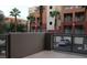 This patio area provides a semi-private outdoor space with views of the complex and its landscaping at 63 E Agate Ave # 202, Las Vegas, NV 89123