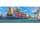 Community tennis court with well-maintained surface, surrounded by lush landscaping and modern residential buildings at 63 E Agate Ave # 202, Las Vegas, NV 89123
