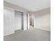 Bright bedroom featuring closet and door to the hallway with neutral carpet at 6460 Raven Hall St, North Las Vegas, NV 89084