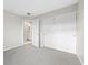 Neutral bedroom with closet, carpet and access to a bathroom at 6460 Raven Hall St, North Las Vegas, NV 89084