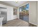 Bright dining area features sliding glass doors with a view to the back patio, and white cabinets at 6460 Raven Hall St, North Las Vegas, NV 89084