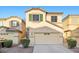 Charming two-story home with a two-car garage, neutral paint, and low-maintenance landscaping at 6460 Raven Hall St, North Las Vegas, NV 89084