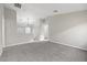 Spacious upstairs landing with neutral carpet, recessed lighting, and views of a secondary room at 6460 Raven Hall St, North Las Vegas, NV 89084