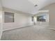Large main bedroom with high ceilings, multiple windows, and gray carpet offers ample space at 6460 Raven Hall St, North Las Vegas, NV 89084