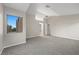 Spacious bedroom with vaulted ceiling, with carpet and ensuite bathroom access at 6460 Raven Hall St, North Las Vegas, NV 89084