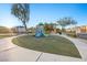 Bright neighborhood playground with slides and green turf at 6460 Raven Hall St, North Las Vegas, NV 89084