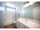 This bathroom features a tub and shower combination, single sink, and tile surround at 6524 Rain Forest Dr, Las Vegas, NV 89108
