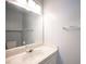 A bathroom features a single sink vanity with updated countertops at 6524 Rain Forest Dr, Las Vegas, NV 89108