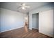 This bedroom features wood-look flooring, closet with sliding doors, and an ensuite bathroom at 6524 Rain Forest Dr, Las Vegas, NV 89108