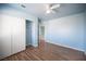 This bedroom features wood-look flooring and closet with sliding doors at 6524 Rain Forest Dr, Las Vegas, NV 89108