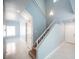 Open entryway with staircase, wood steps, and view to adjacent living areas at 6524 Rain Forest Dr, Las Vegas, NV 89108