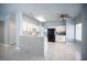 Modern kitchen featuring white cabinets, breakfast bar, stainless steel appliances, and tile floors at 6524 Rain Forest Dr, Las Vegas, NV 89108