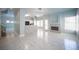 Spacious living room featuring a modern fireplace, tiled floors, and plenty of natural light at 6524 Rain Forest Dr, Las Vegas, NV 89108