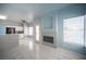 Inviting living space with a modern fireplace, tile flooring, and ample natural light at 6524 Rain Forest Dr, Las Vegas, NV 89108
