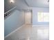 Open and inviting living area with tiled floors, front door, and a large window at 6524 Rain Forest Dr, Las Vegas, NV 89108