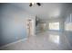 Bright living area with marble floors and a view of the staircase to the second floor at 6524 Rain Forest Dr, Las Vegas, NV 89108