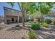 The backyard boasts a patio, balcony, landscaping, and a decorative rock garden at 68 Vista Del Mar St, Henderson, NV 89012