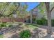 Lush backyard with mature landscaping, turf lawn, and decorative rocks at 68 Vista Del Mar St, Henderson, NV 89012