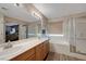 Spacious bathroom offers a double vanity, soaking tub, and glass-enclosed shower at 68 Vista Del Mar St, Henderson, NV 89012