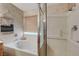 Close-up on soaking tub and glass shower at 68 Vista Del Mar St, Henderson, NV 89012